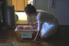 Julie weighing baby